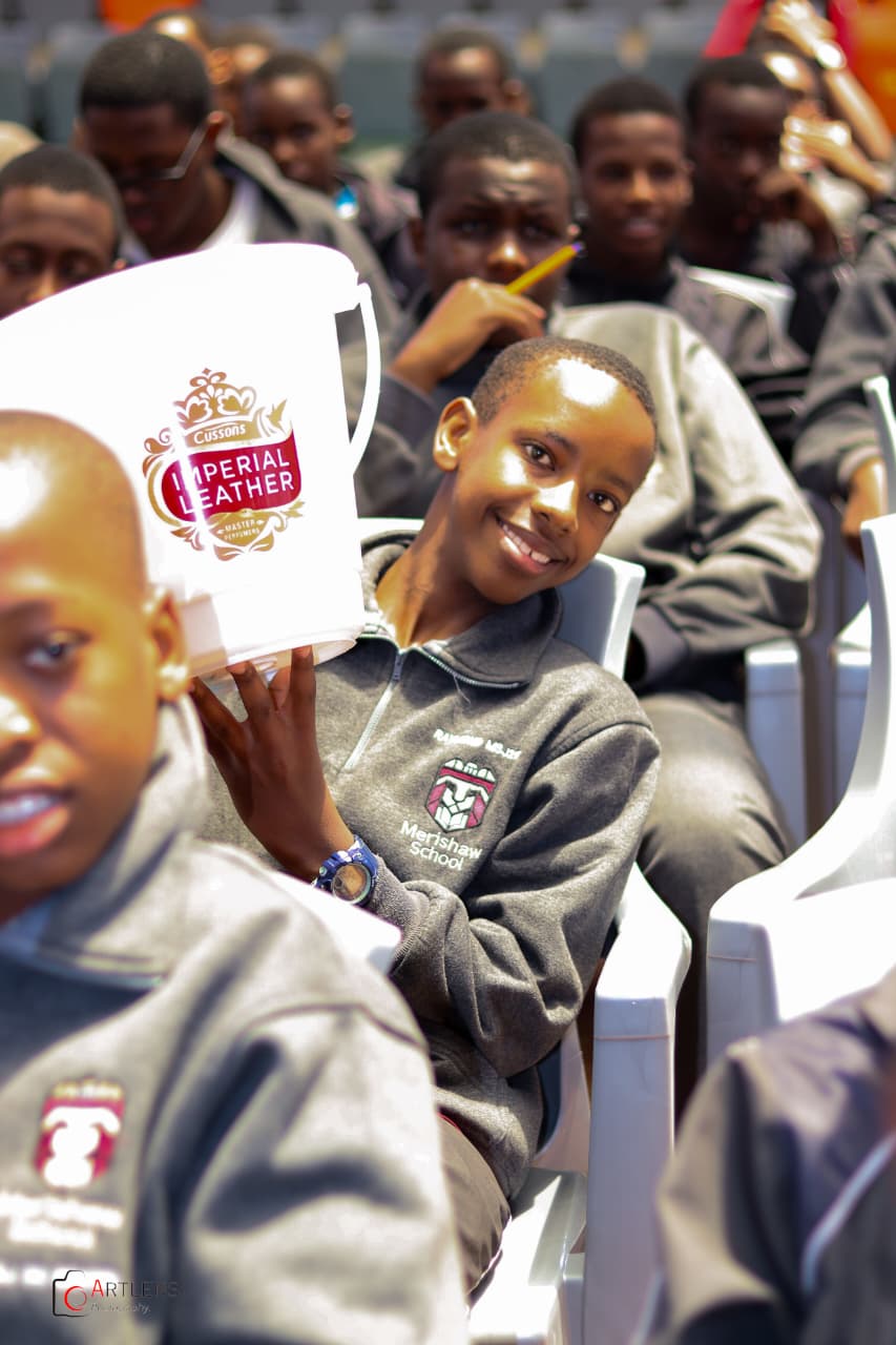 Student in the audience with an Illuminate gift