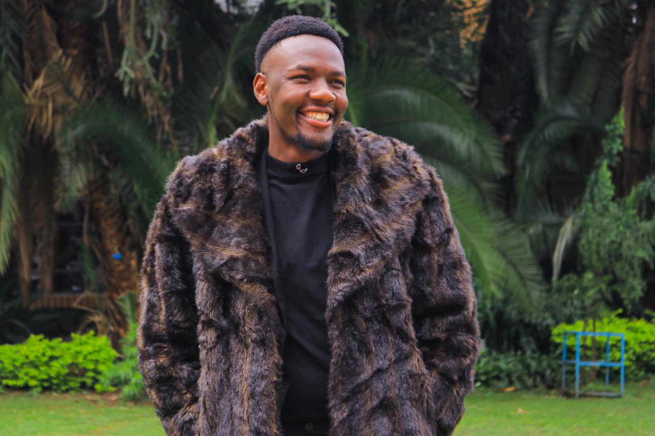 Gibendi Moselyne, CEO of Artspace Productions, smiling outdoors